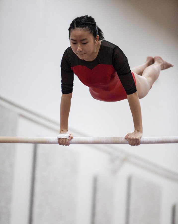 Junior Cindy Nguyen on the Uneven Bars.
