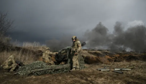 Ukrainian soldiers firing artillery at Russian troops near the city of Bakhmut. 
