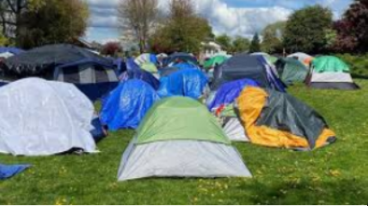 Migrants Camp Out in CD Park while the  City Scrambles to House Them