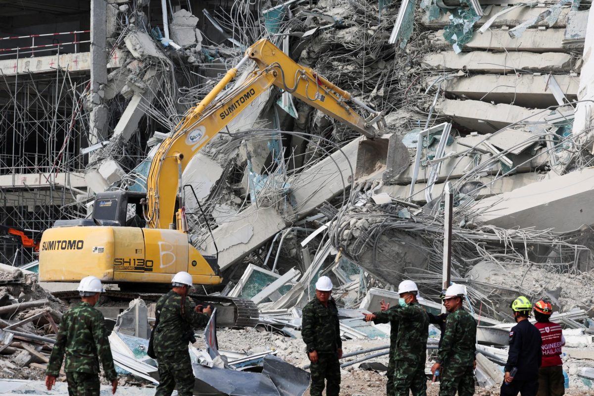 Rescue personnel work at the site of a building that collapsed, following a strong earthquake, in Bangkok, Thailand, March 29, 2025. REUTERS/Chalinee Thirasupa