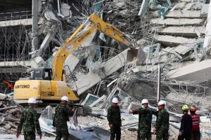 Rescue personnel work at the site of a building that collapsed, following a strong earthquake, in Bangkok, Thailand, March 29, 2025. REUTERS/Chalinee Thirasupa