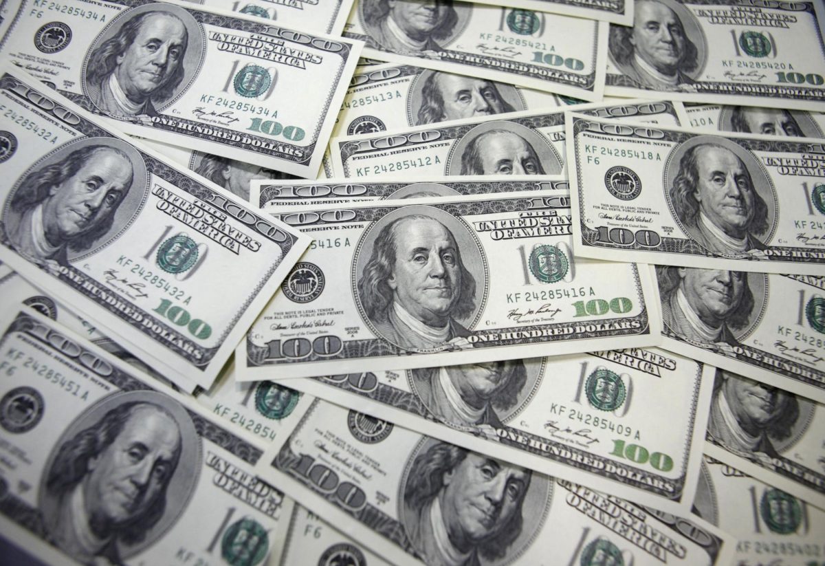 U.S. 100-dollar notes are seen at a bank in this picture illustration. REUTERS/Lee Jae-Won