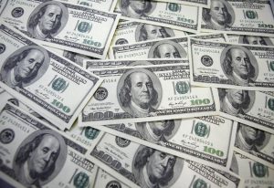 U.S. 100-dollar notes are seen at a bank in this picture illustration. REUTERS/Lee Jae-Won