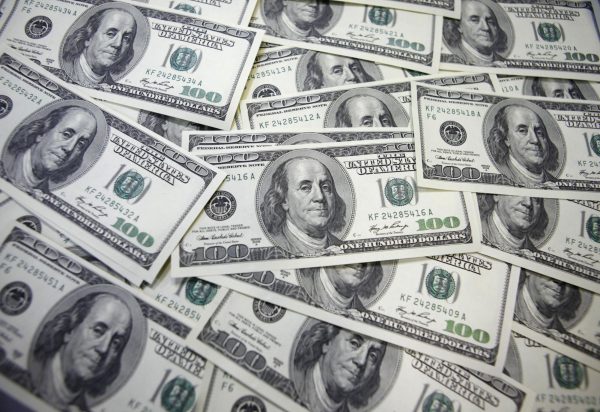 U.S. 100-dollar notes are seen at a bank in this picture illustration. REUTERS/Lee Jae-Won