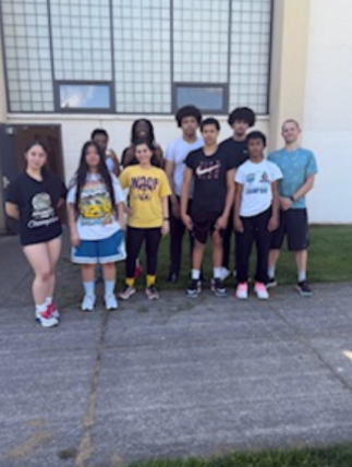 A picture of rowing club adviser and rowers.

