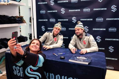 Photo of a few Seattle Kraken players at the event.