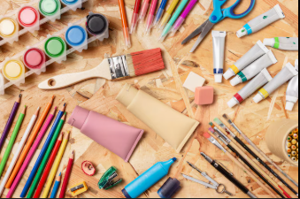 Picture of artist supplies on a table.