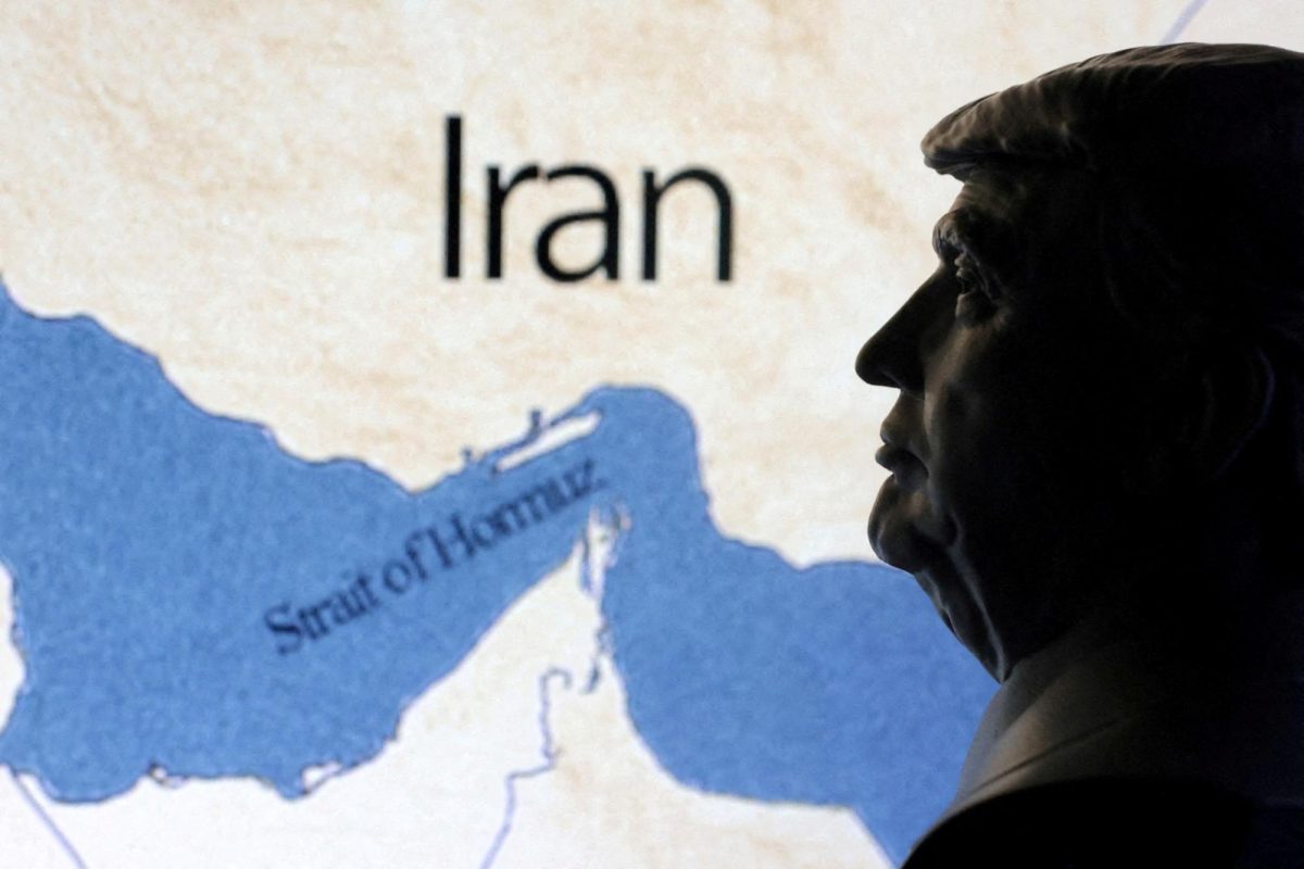 Illustration of a map showing the Strait of Hormuz and Iran seen behind a 3D printed miniature of U.S. President Donald Trump. REUTERS/Dado Ruvic/Illustration