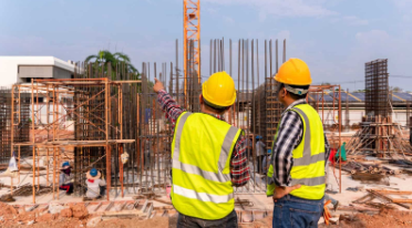 Picture of two civil engineers analyzing a foundation base.