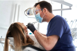 Photo of a dentist working on a patient.