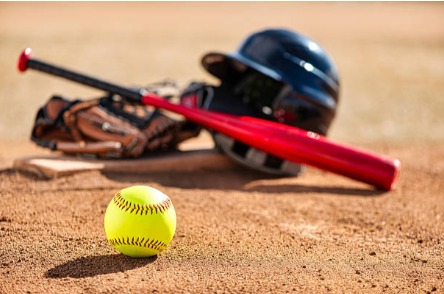 Photo of softball equipment including a softball, bat, helmet, and glove.