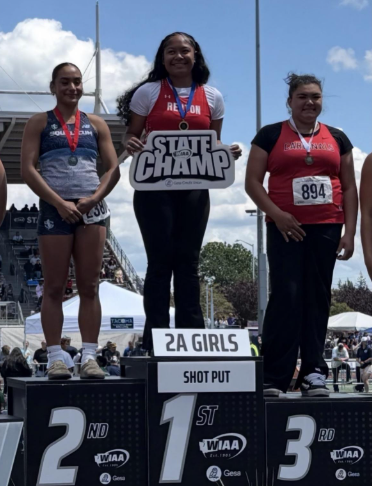 Photo of Angela Fiame after she won Girls 2a State for Shot Put.