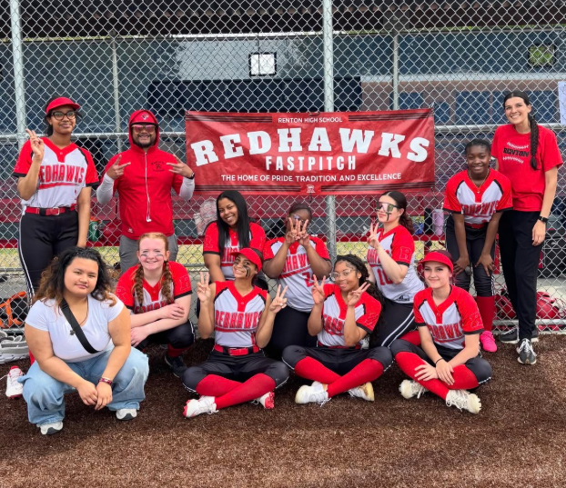 Photo of the softball team after their win against Sultan to advance them in the tournament.